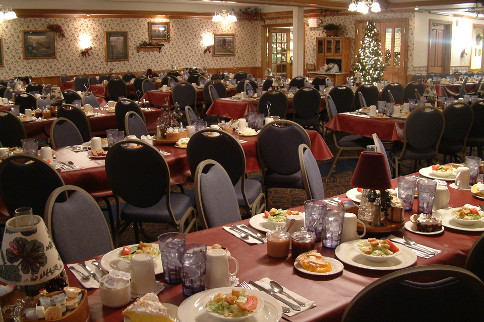 Long tables are set for a large group at the Blue Gate Restaurant
